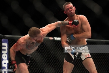 513972668-conor-mcgregor-punches-nate-diaz-in-their-gettyimages